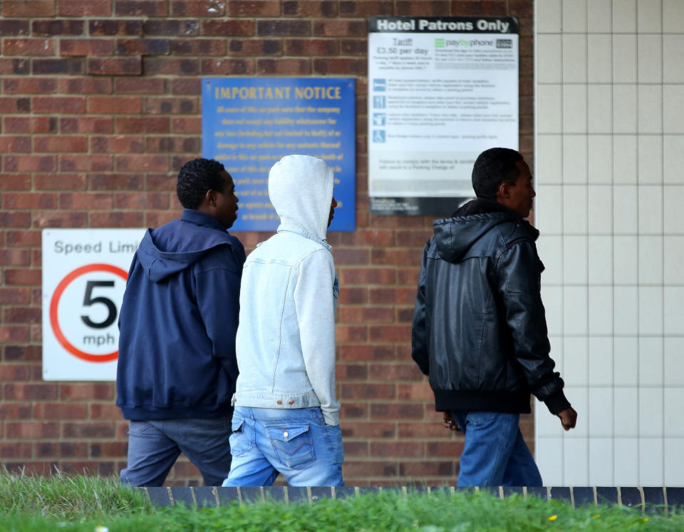 A group of men thought to be asylum seekers arrive at the Grand Burstin Hotel in Folkestone, Kent, where asylum seekers have been moved to the seafront hotel by the Home Office in order to ease overcrowding elsewhere.