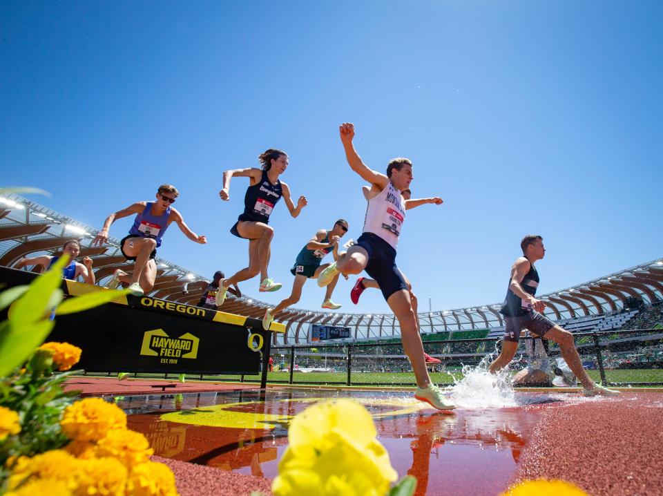 Runners navigate the water jump in the men’s 3,000 meter steeplechase final at the USA Track and Field Championships Saturday, June 25, 2022, at Hayward Field in Eugene, Ore. 