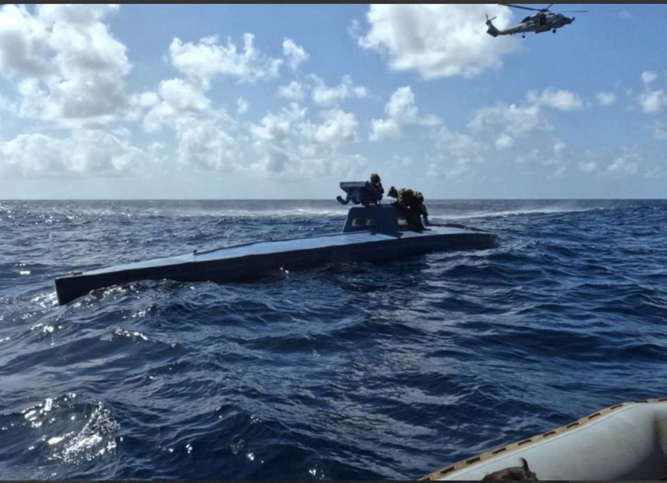 Coast Guard members who were deployed on the U.S. Navy’s USS Leyte Gulf board a semi-submersible vessel in the Atlantic in March 2024. The vessel had 600 kilograms of cocaine aboard, according to the Navy.