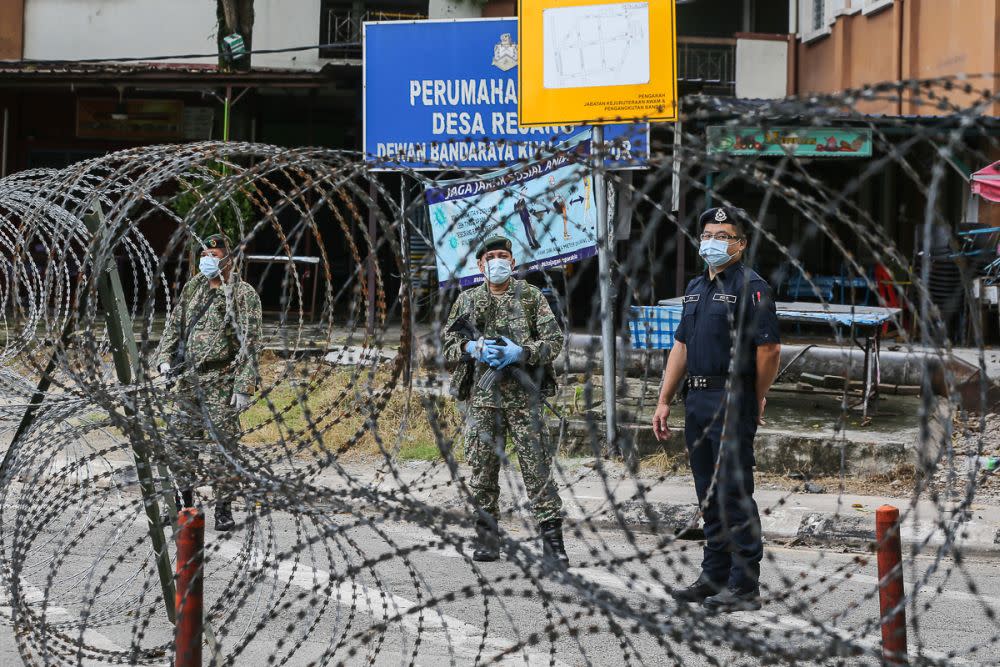 Armed Forces and police personnel patrol the vicinity of the Desa Rejang People’s Housing Project in Kuala Lumpur amid the enhanced movement control order June 21, 2021. — Picture by Yusof Mat Isa