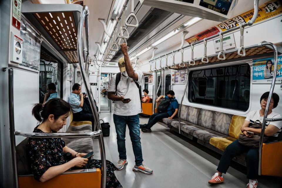 Ajit Roy takes public transportation to attend a medical health check up appointment at Samsung Seoul Hospital in Seoul.