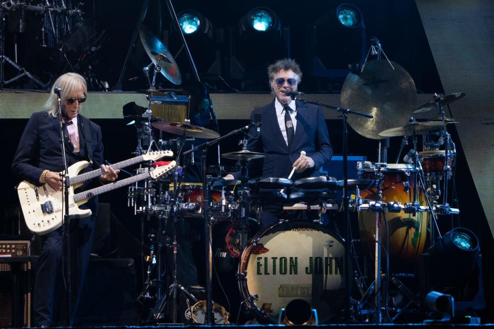 Band members Davey Johnstone (guitar) and John Mahon (drums/percussion) perform with Elton John at the Alamodome in San Antonio, Texas, on Saturday, Oct. 29, 2022.