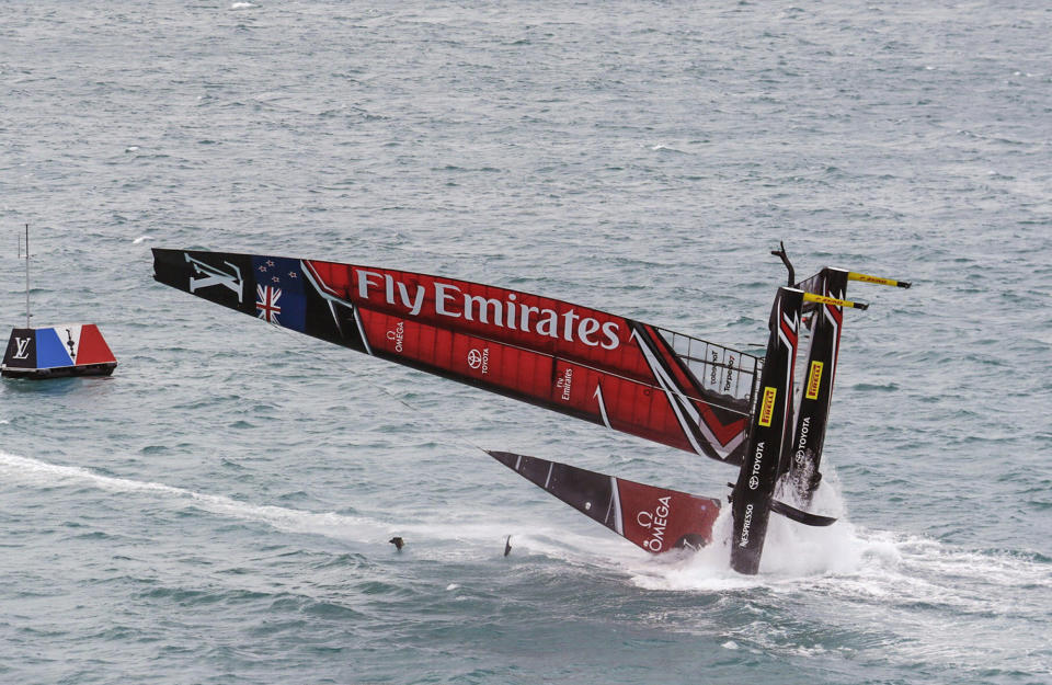 <p>In this photo provided by America’s Cup Event Authority, Emirates Team New Zealand capsizes during an America’s Cup challenger semifinal against Great Britain’s Land Rover BAR on the Great Sound in Bermuda on Tuesday, June 6, 2017. (Gilles Martin-Raget/ACEA via AP) </p>