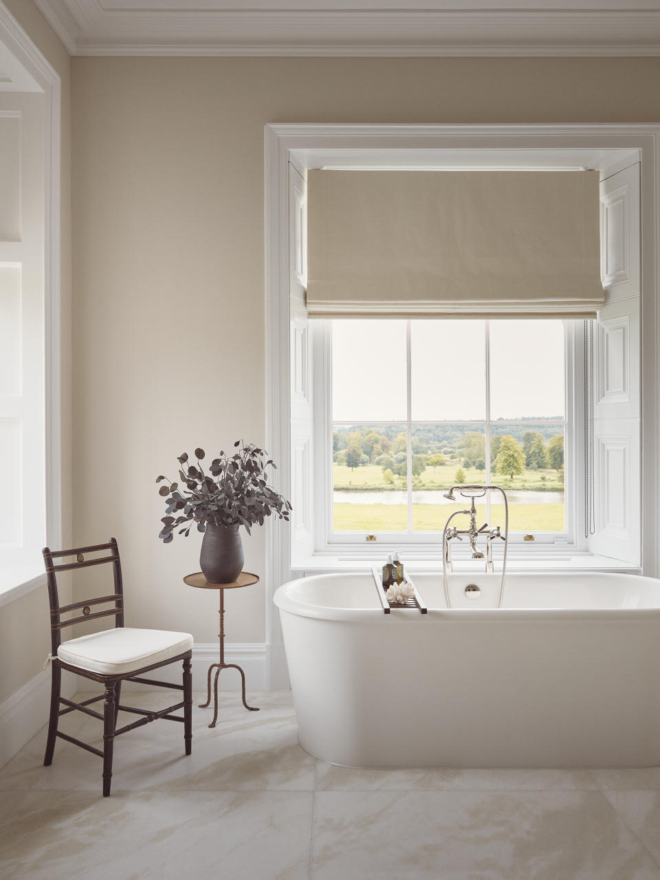 Beige bathroom with a freestanding bath