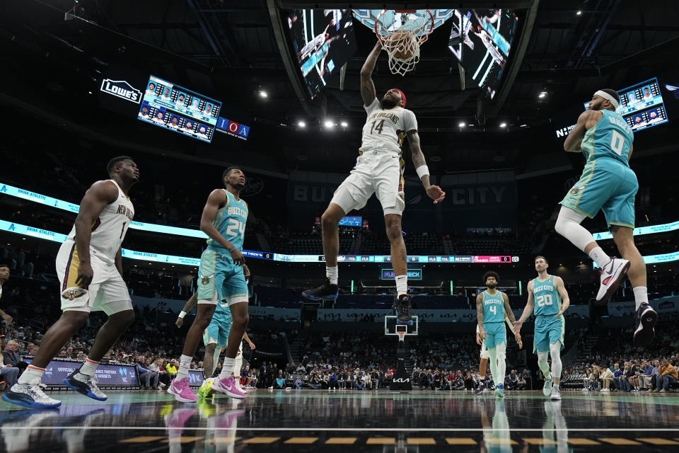 New Orleans Pelicans forward Brandon Ingram dunks against the Charlotte Hornets during the first half of an NBA basketball game Friday, Dec. 15, 2023, in Charlotte, N.C. (AP Photo/Chris Carlson)