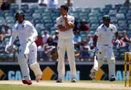 Cricket - Australia v South Africa - First Test cricket match - WACA Ground, Perth, Australia - 6/11/16. Australia's Mitchell Starc (C) reacts as South Africa's Vernon Philander (R) and Quinton de Kock run between wickets at the WACA Ground in Perth. REUTERS/David Gray