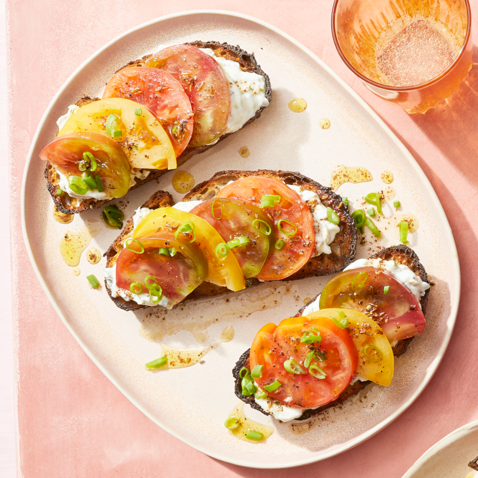 tomato toasts with mint yogurt and sumac vinaigrette