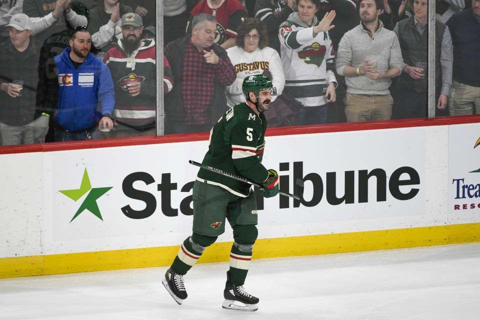 Minnesota Wild defenseman Jacob Middleton celebrates after scoring against the Seattle Kraken during the first period of an NHL hockey game Monday, March 27, 2023, in St. Paul, Minn. (AP Photo/Craig Lassig)