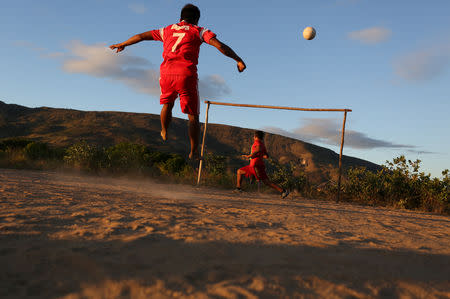 Indigenous Macuxi people play soccer at the community of Maturuca on the Raposa Serra do Sol reservation, Roraima state, Brazil February 9, 2019. REUTERS/Bruno Kelly