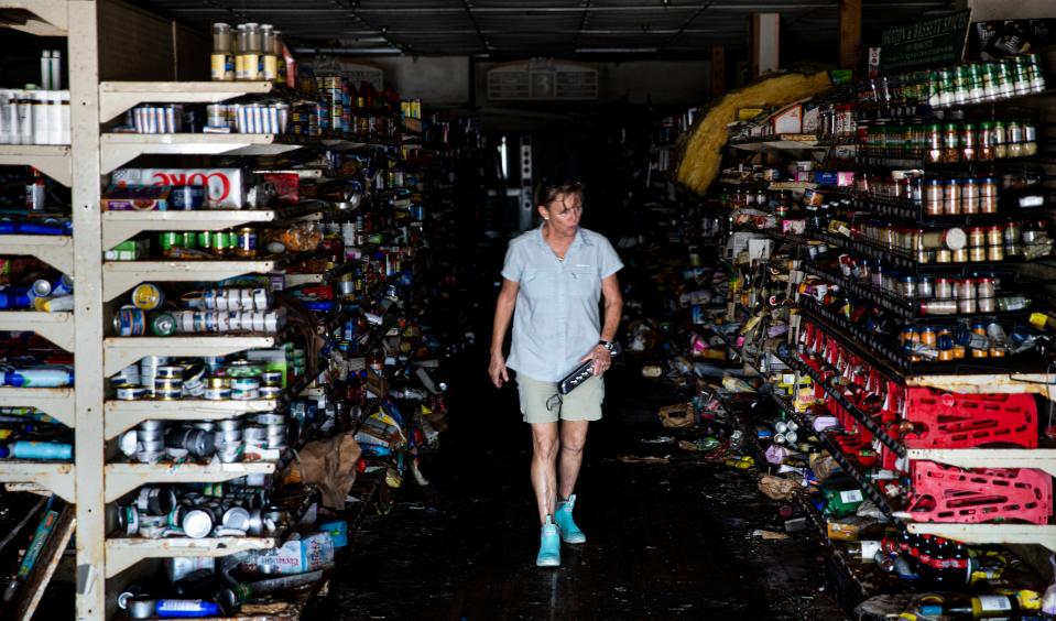 Mead Johnson, one of the owners of Bailey’s General Store on Sanibel looks at destroyed shelves on Wednesday, Jan. 4, 2023 after it was flooded by Hurricane Ian. The plan is to tear down the existing building and re-open in a rebuilt space that will be raised.  