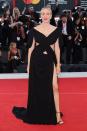 <p>Chloë Sevigny wore Gucci Cosmogonie look 22 - a black jersey short sleeve gown with deep V-neck, cut-out and high slit details with black patent leather high heel sandals. </p>