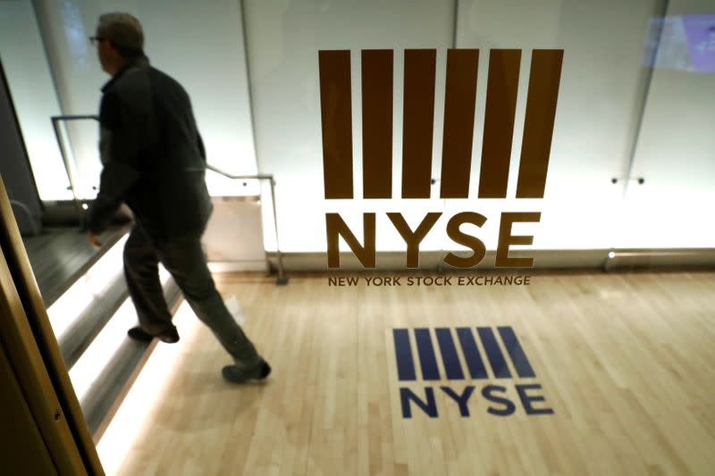 A man walks from the floor of the New York Stock Exchange (NYSE) in New York