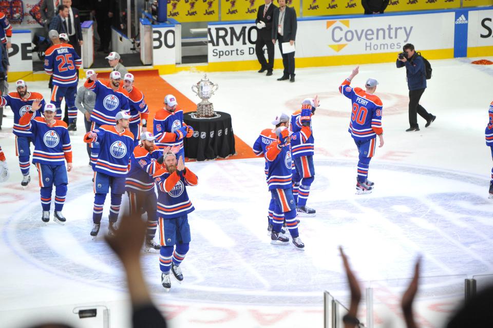 Jun 2, 2024; Edmonton, Alberta, CAN; Edmonton Oilers players pose with the Western Conference trophy at the end of the third period in game six of the Western Conference Final of the 2024 Stanley Cup Playoffs at Rogers Place. Mandatory Credit: Walter Tychnowicz-USA TODAY Sports