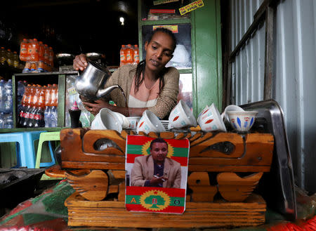 A woman serves coffee at a cafe in the town of Ambo, Oromiya region, Ethiopia, October 16, 2018. REUTERS/Tiksa Negeri