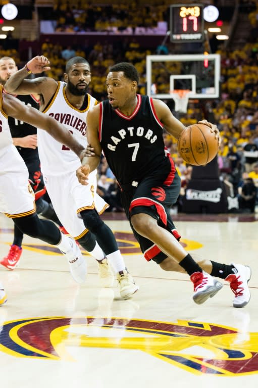 Kyle Lowry of the Toronto Raptors drives around Kyrie Irving of the Cleveland Cavaliers in Game One of the NBA Eastern Conference semi-finals, at Quicken Loans Arena in Cleveland, Ohio, on May 1, 2017