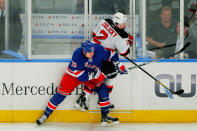 NEW YORK, NY - MAY 23: Ruslan Fedotenko #26 of the New York Rangers checks Marek Zidlicky #2 of the New Jersey Devils in Game Five of the Eastern Conference Final during the 2012 NHL Stanley Cup Playoffs at Madison Square Garden on May 23, 2012 in New York City. (Photo by Paul Bereswill/Getty Images)