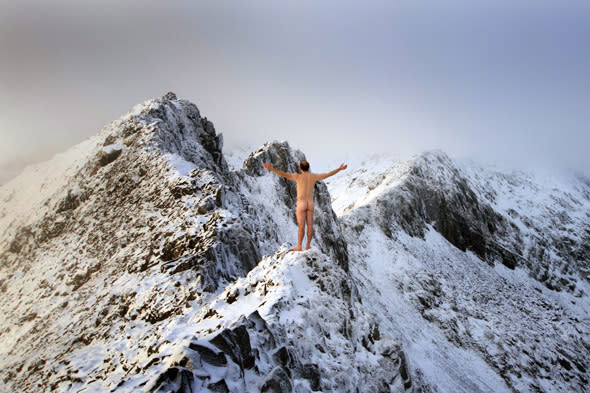 Naked Dan Arkle scales icy mountain in Wales