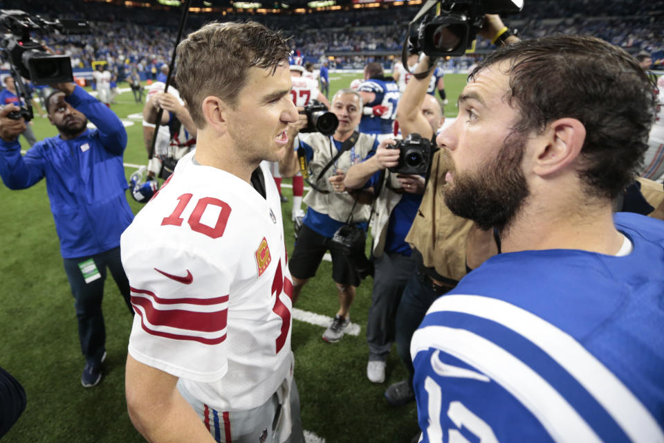 Indianapolis Colts quarterback Andrew Luck (12) greets New York Giants quarterback Eli Manning (10) following an NFL football game in Indianapolis, Sunday, Dec. 23, 2018. (AP Photo/AJ Mast)