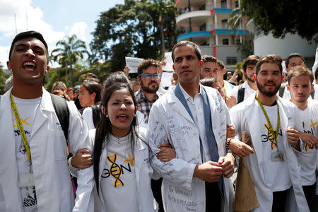 Venezuelan opposition leader and self-proclaimed interim president Juan Guaido takes part in a protest against Venezuelan President Nicolas Maduro's government in Caracas, Venezuela January 30, 2019. REUTERS/Carlos Garcia Rawlins