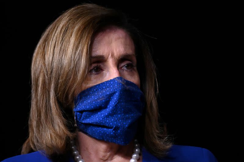 FILE PHOTO: U.S. House Speaker Nancy Pelosi listens during a news conference in the U.S. Capitol in Washington