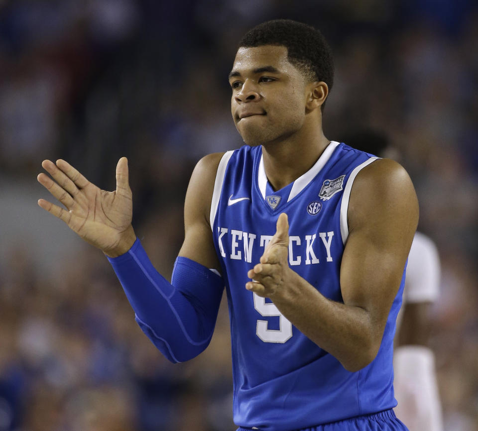 Kentucky guard Andrew Harrison reacts during the first half of the NCAA Final Four tournament college basketball championship game against Connecticut Monday, April 7, 2014, in Arlington, Texas. (AP Photo/David J. Phillip)