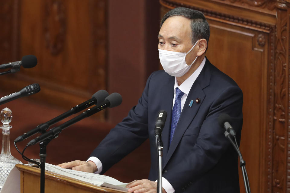 Japanese Prime Minister Yoshihide Suga delivers a policy speech during an ordinary Diet session at the upper house of parliament in Tokyo, Monday, Jan. 18, 2021. (AP Photo/Koji Sasahara)