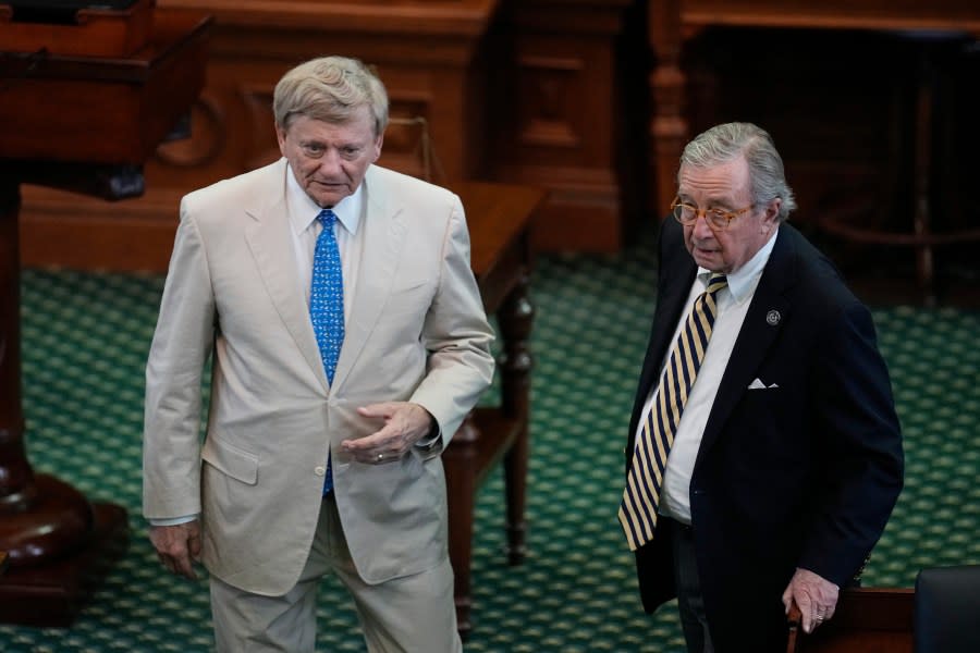 Prosecution attorneys Rusty Hardin, left, and Dick DeGuerin talk after the prosecution rested in the impeachment trial for Texas Attorney General Ken Paxton in the Senate Chamber at the Texas Capitol, Wednesday, Sept. 13, 2023, in Austin, Texas. (AP Photo/Eric Gay)