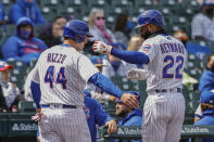 Chicago Cubs' Anthony Rizzo (44) celebrates with Jason Heyward (22) after scoring against the Pittsburgh Pirates during the fourth inning of a baseball game, Sunday, May 9, 2021, in Chicago. (AP Photo/Kamil Krzaczynski)