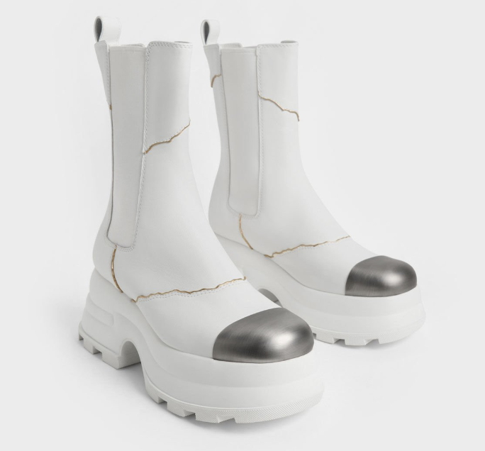 The Both Paris X Charles & Keith Jules Leather Chelsea Boots is mid-calf length and in white.