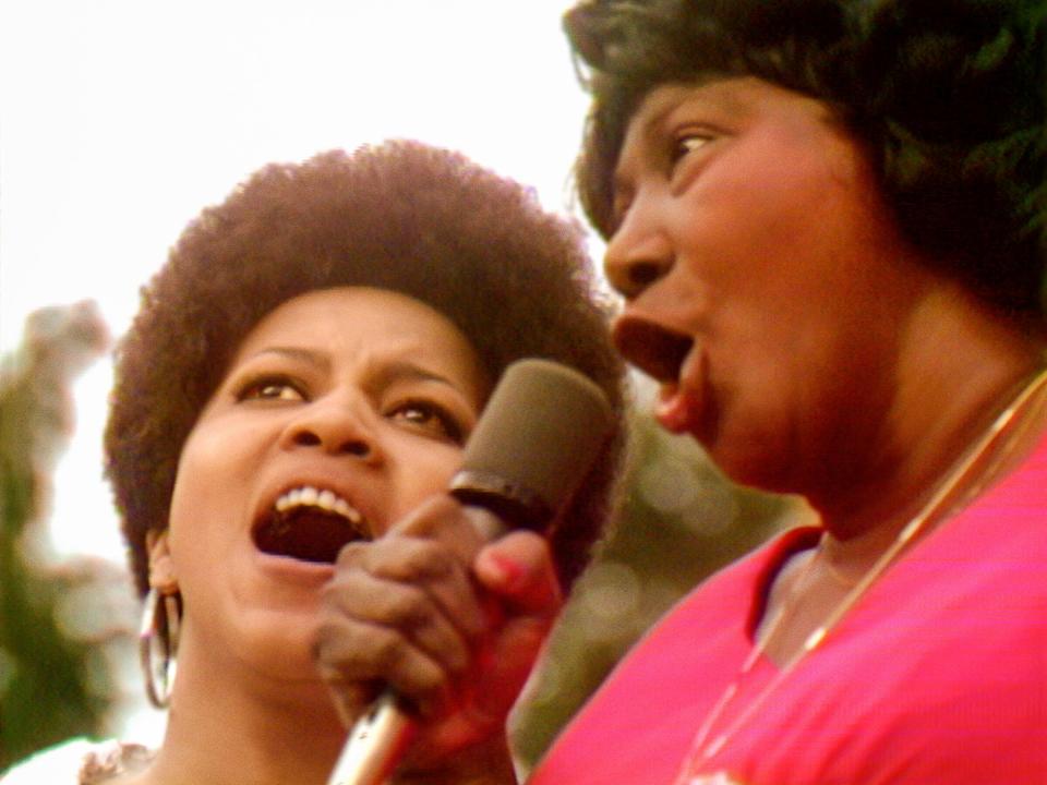 Mavis Staples, left, and Mahalia Jackson perform at the Harlem Cultural Festival in 1969, in a scene from the documentary "Summer of Soul."