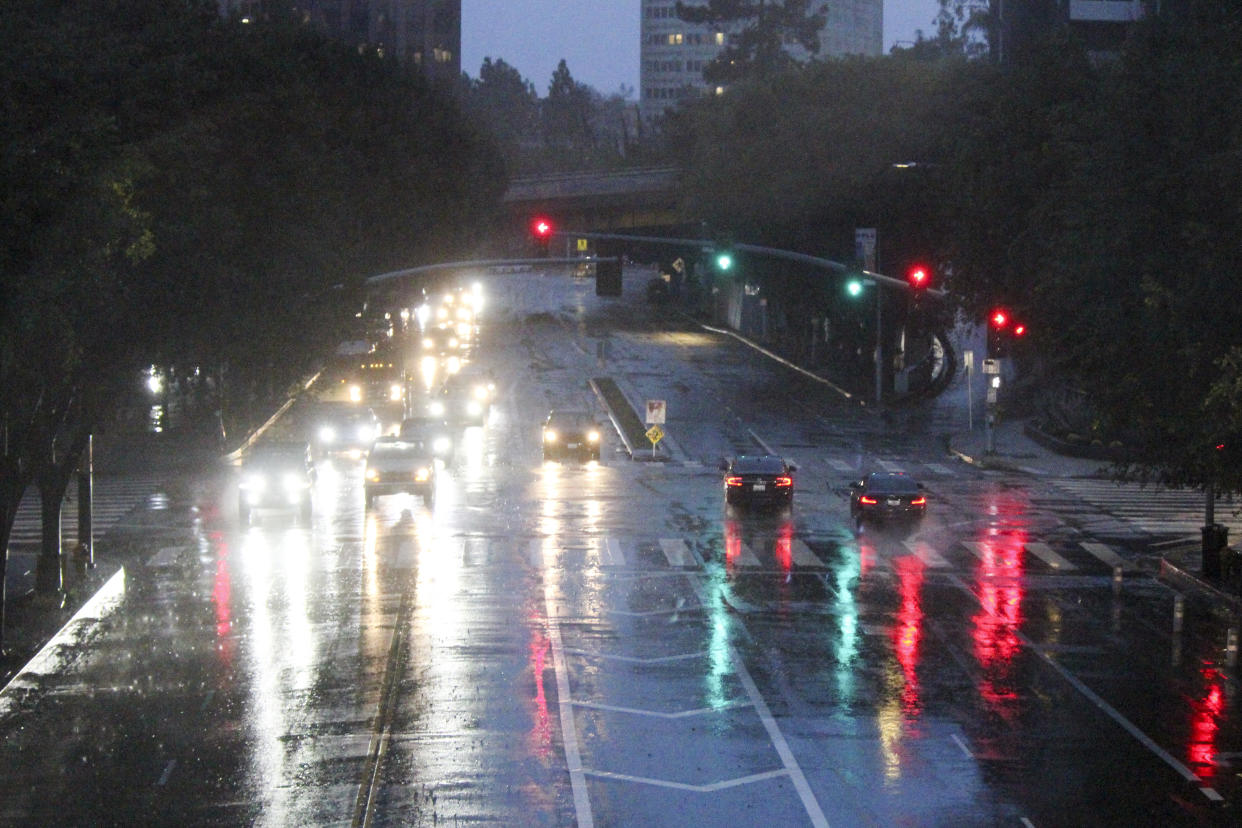 Motorists drive through storm conditions in downtown Los Angeles on Feb. 1.