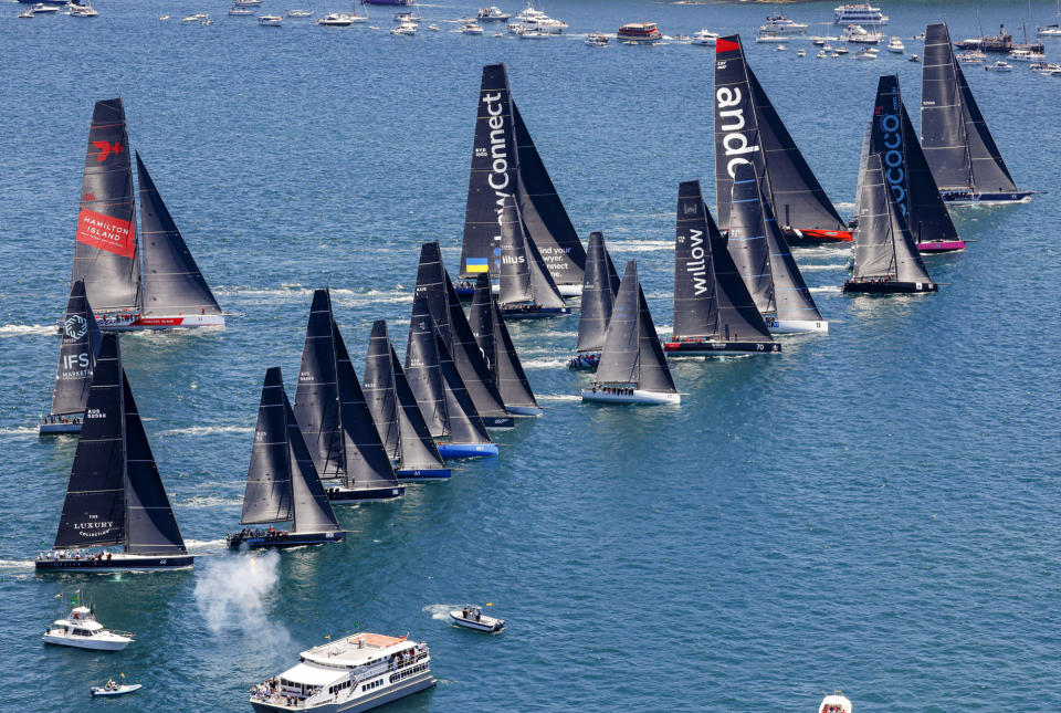 In this photo provided by ROLEX, boats line up at the the start of the Sydney Hobart yacht race on Sydney Harbour, Australia, Monday, Dec. 26, 2022. (Carlo Borlenghi/ROLEX via AP)