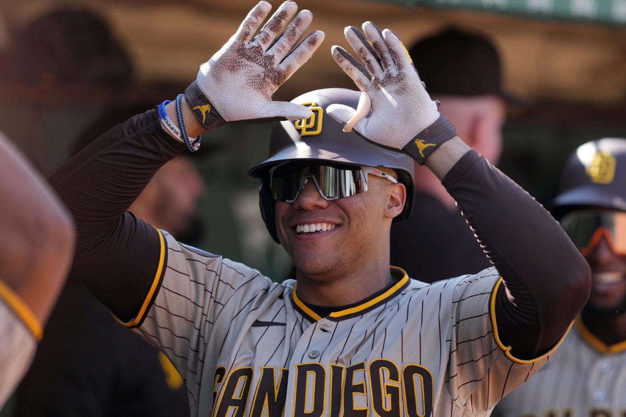 Sep 17, 2023; Oakland, California, USA; San Diego Padres left fielder Juan Soto (22) celebrates with teammates after hitting a grand slam home run against the Oakland Athletics during the eighth inning at Oakland-Alameda County Coliseum. Mandatory Credit: Darren Yamashita-USA TODAY Sports