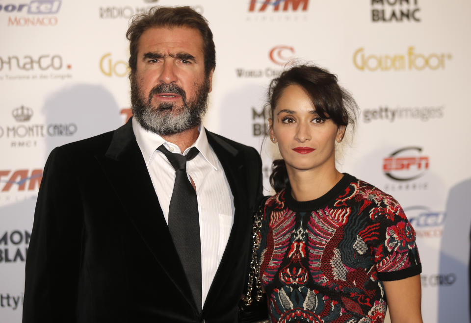 French former soccer player  Eric Cantona arrives with his wife Rachida Brakni at the ceremony of the "Golden Foot 2012" awards, in Monaco, Wednesday, Oct. 17, 2012.  (AP Photo/Lionel Cironneau)