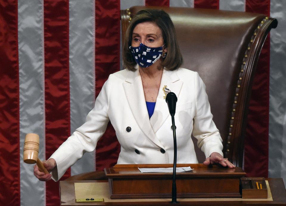 US Speaker of the House Nancy Pelosi, Democrat of California, raps her gavel after the House voted on the American Rescue Plan, the $1.9 trillion Covid-19 relief plan, at the US Capitol on March 10, 2021 in Washington, DC. - The US Congress on Wednesday passed Joe Biden's enormous economic relief package, delivering a resounding victory for the US president and a desperately needed injection of cash to millions of families and businesses enduring the coronavirus pandemic. (Photo by OLIVIER DOULIERY / AFP) (Photo by OLIVIER DOULIERY/AFP via Getty Images)