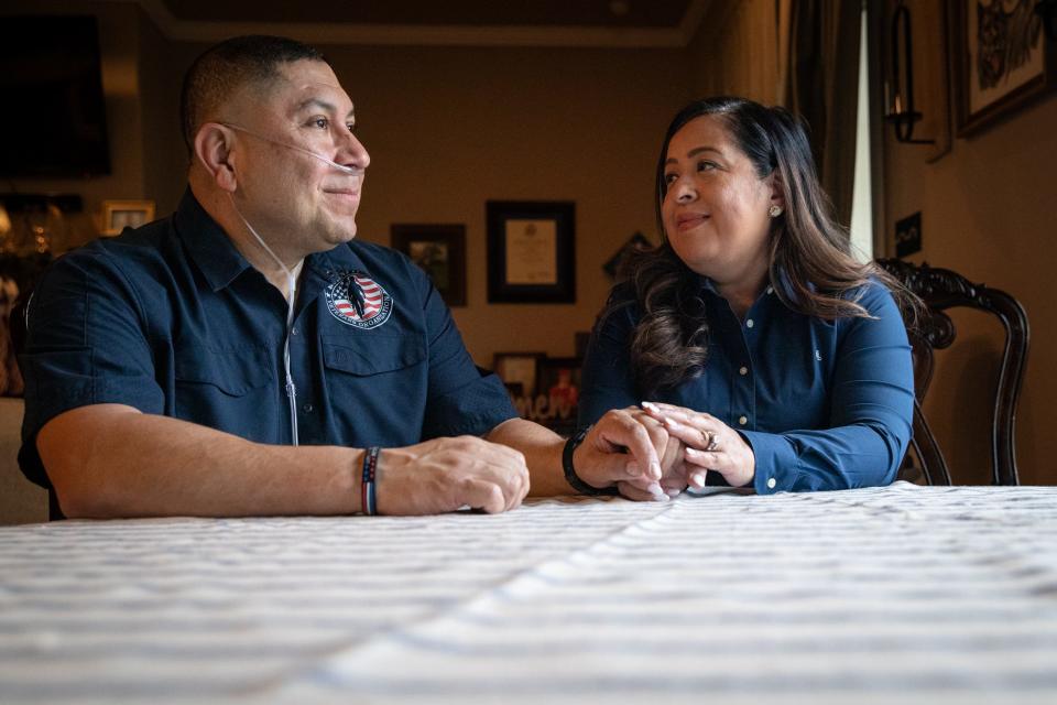 Le Roy and Rosie Torres sit at their kitchen table, where they began their nonprofit veterans organization, Burn Pits 360, in Robstown. Their efforts led to the passage of the PACT Act, expanding health benefits to veterans exposed to burn pits.