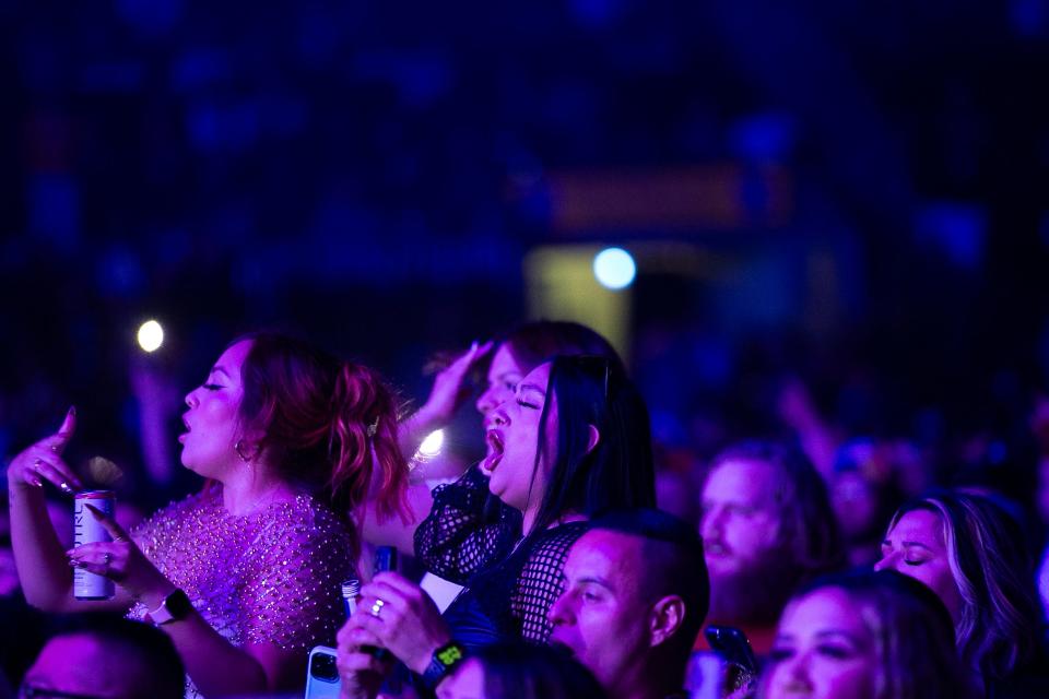 Crowd members sing along to rapper Gorilla Zoe at the Welcome to Tha Carter Tour at American Bank Center Friday, Nov. 17, 2023.