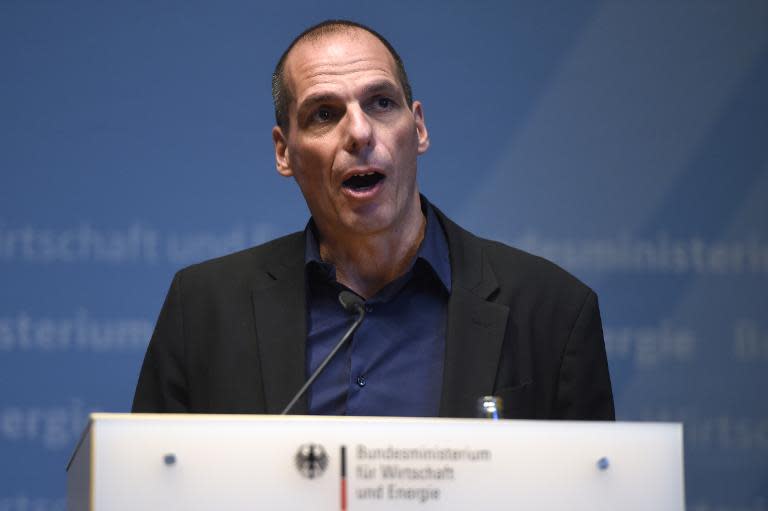 Greece's new Finance Minister Yanis Varoufakis attends a press conference after a meeting with the German Economy minister in Berlin, on February 5, 2015