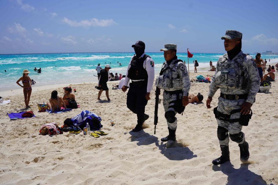 Members of the Mexican Navy and National Guard patrol the tourist beach area of Cancun, Quintana Roo state, Mexico in March 18, 2023.