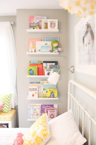 <p>Having a huge collection of children's books mean you don't have to listen to the same tale every single night - but adds major clutter to your child's room. Use IKEA's picture ledges to create floating shelves for as many hardbacks as you need.</p><p><em><a rel="nofollow noopener" href="http://www.daffodildesign.com/2012/04/i-decorate-room-for-two.html" target="_blank" data-ylk="slk:See more at Daffodil Designs »;elm:context_link;itc:0;sec:content-canvas" class="link ">See more at Daffodil Designs »</a></em></p>