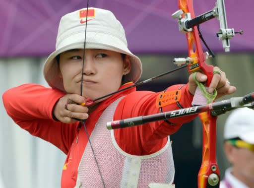 Cheng Ming of China prepares to shoot the arrow during the ranking round of the women's archery individual event at the Lord's Cricket Ground in London