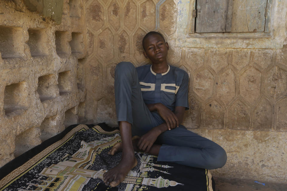 Usama Aminu, 17 year-old, a kidnapped student of the Government Science Secondary School who escaped from bandits is seen during an interview with The Associated Press in Kankara, Nigeria, Wednesday, Dec. 16, 2020. The school boy who escaped says the students were kidnapped by young, armed men in military uniform. Rebels from the Boko Haram extremist group claimed responsibility Tuesday for abducting hundreds of boys from a school in Nigeria's northern Katsina State last week in one of the largest such attacks in years, raising fears of a growing wave of violence in the region. (AP Photo/Sunday Alamba)