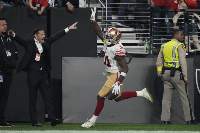 49ERS RICHEY/C/08NOV98/SP/MAC 49ers celebrate after 7-Wade Richey, left  hits a 46 yard field goal to put the niners ahead in the 4th quarter.  81-Terrell Owens and 57-Randy Kirk join the celebration. by