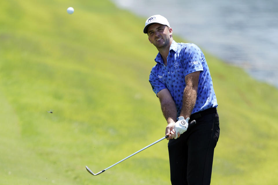 Denny McCarthy chips to the 18th green during the second round of the St. Jude Championship golf tournament Friday, Aug. 12, 2022, in Memphis, Tenn. (AP Photo/Mark Humphrey)