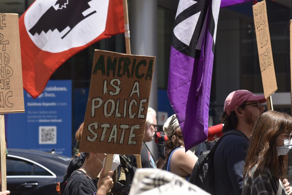 During the Coalition to March on the RNC's permit protest on June 15, protesters held up signs criticizing police departments' power, reiterating the Milwaukee Alliance Against Racist and Political Repression's call for community control of the police.