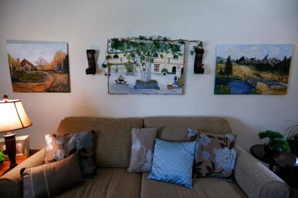 Paintings on the wall at Virginia Morrow's home in Sparta on Friday, May 13, 2022.