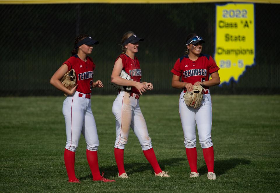 Tecumseh outfielders, from left, Alena Holder (20), Katelyn Marx (2) and Payge Johnson (5) prepare for the top of the inning against Castle during their game at Tecumseh High School Wednesday evening, May 10, 2023. Castle won the game 7-4 in extra innings.