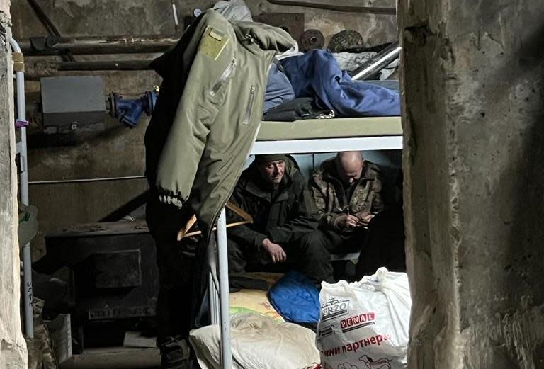 Ukrainian forces rest in a bunker on the front line near the eastern city of Bakhmut, amid Russia's ongoing invasion of the country in late January 2023.  / Credit: CBS News