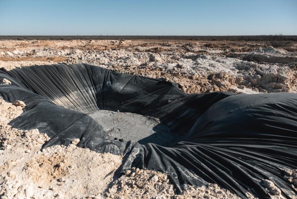 A pit built to collect the leaking water is seen Saturday, Feb. 24, 2024 on Bill Wight’s land in Crane County. Crews contracted by the Railroad Commission of Texas would then further haul the collected water offsite.