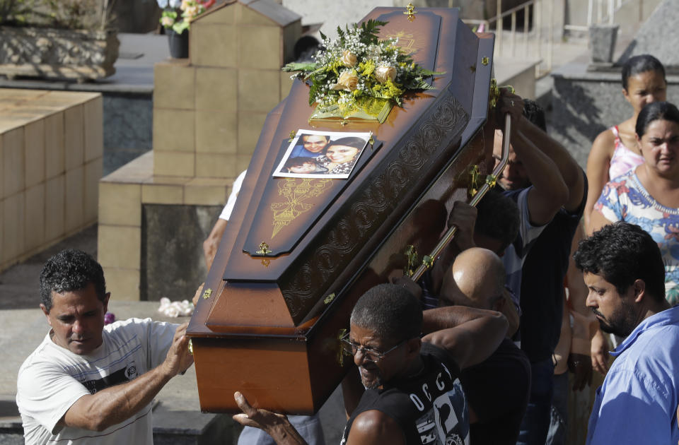 FILE - In this Jan. 29, 2019, file photo, friends and relatives carry the coffin with the body of Vale SA contractor Edmayra Samara, victim of a collapsed dam, during her burial in Brumadinho, Brazil. The Danish pension fund for academics began selling off its stake in a Brazilian mining company, Vale, after two of the company's tailings dams collapsed, killing hundreds of people. So did Sweden's national pension. The main goal of institutional investors is to maximize returns. But now, more than ever, many are considering issues such as climate change and human rights. (AP Photo/Andre Penner, File)